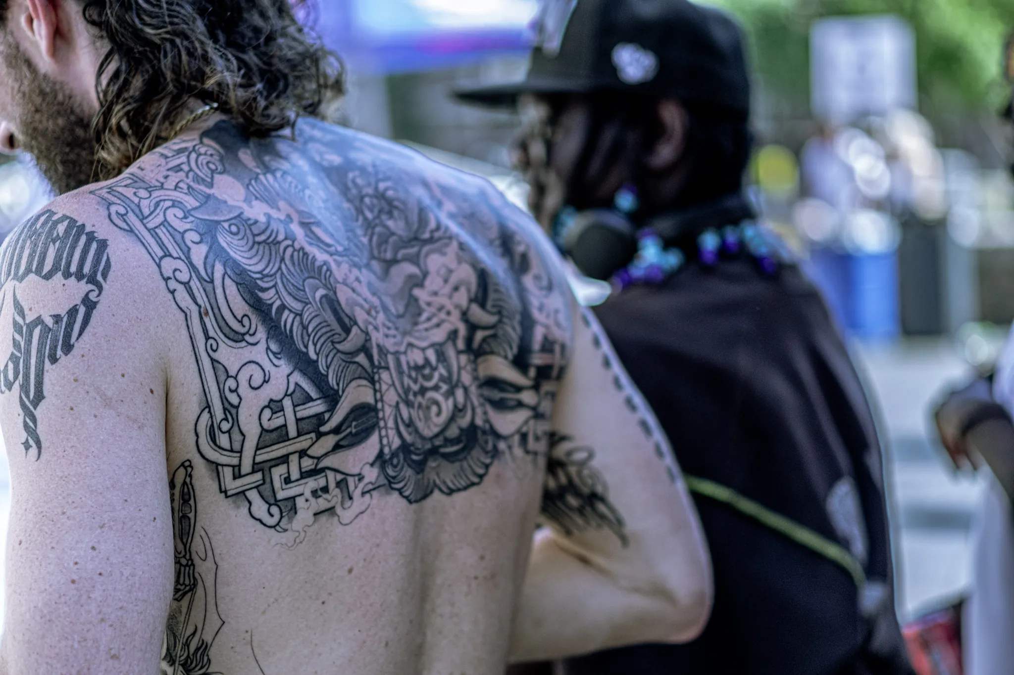 Street photography in the Netherlands Rotterdam Zadkine school skate contest redbull man with a tatoo.