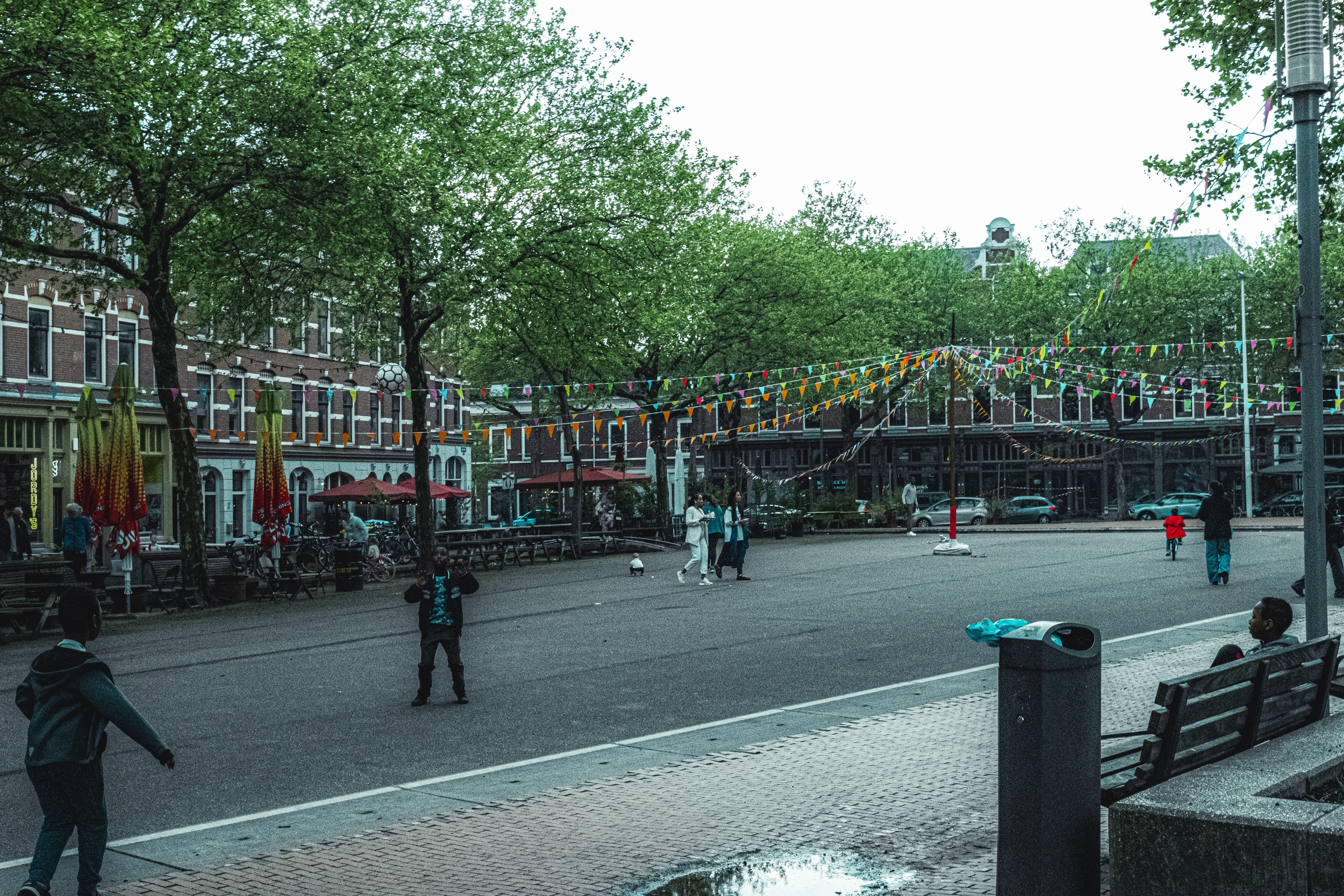 Street photography in Rotterdam the Netherlands of young people playing soccer game.