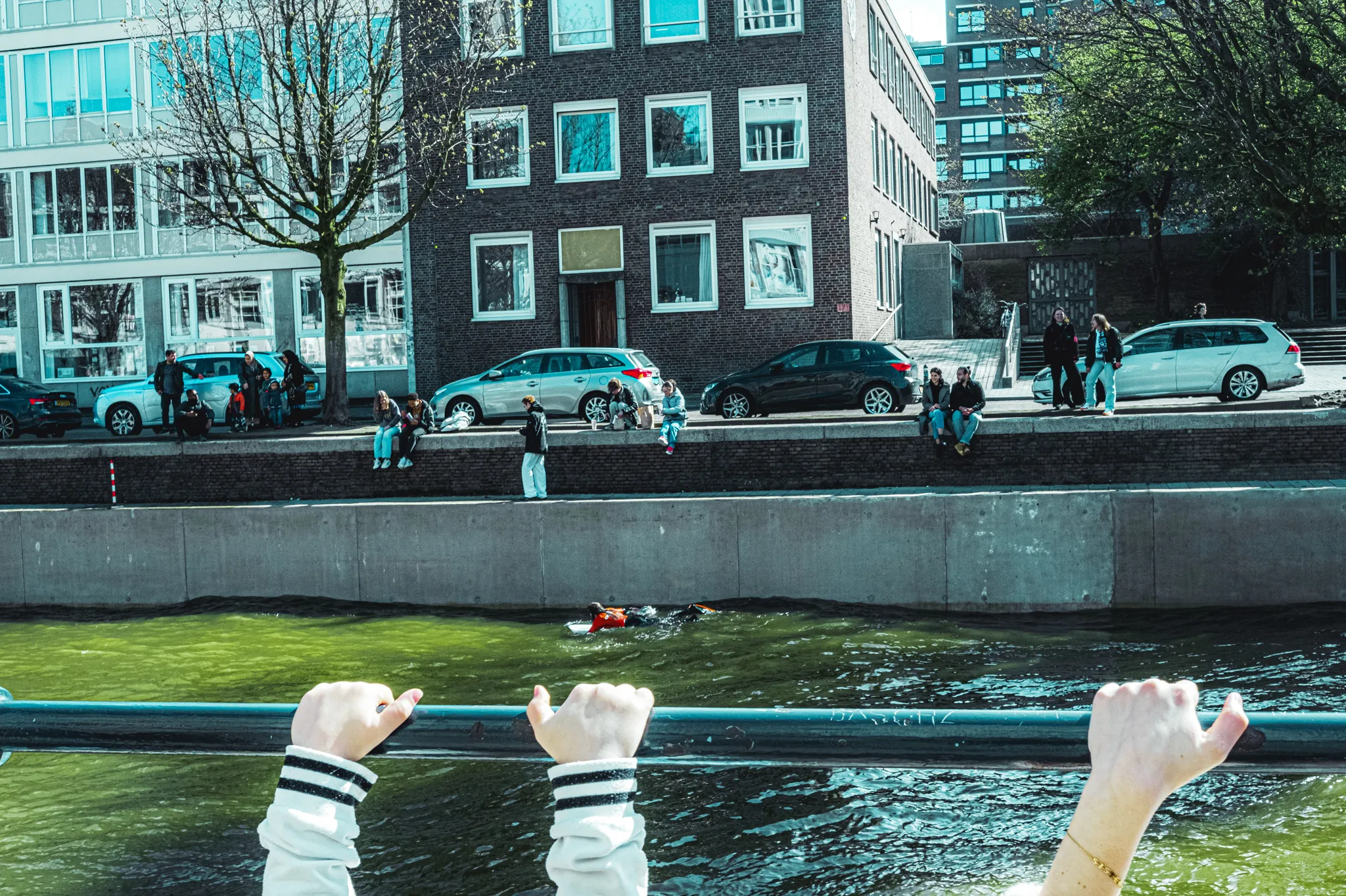 Street photography in the Netherlands Rotterdam of hands holding a rail.