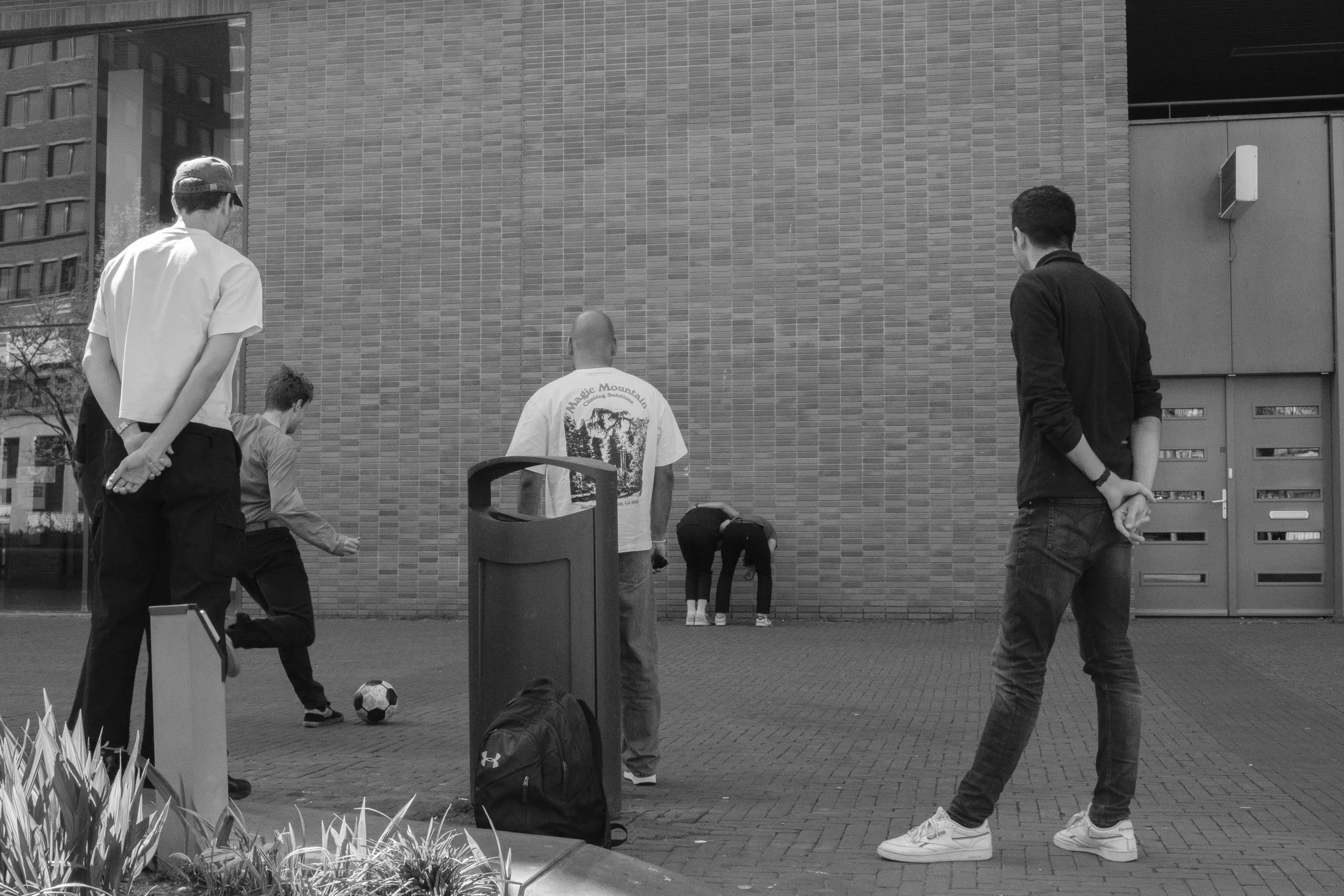 Street photography in the Netherlands Rotterdam at the market of people playing a soccer game.