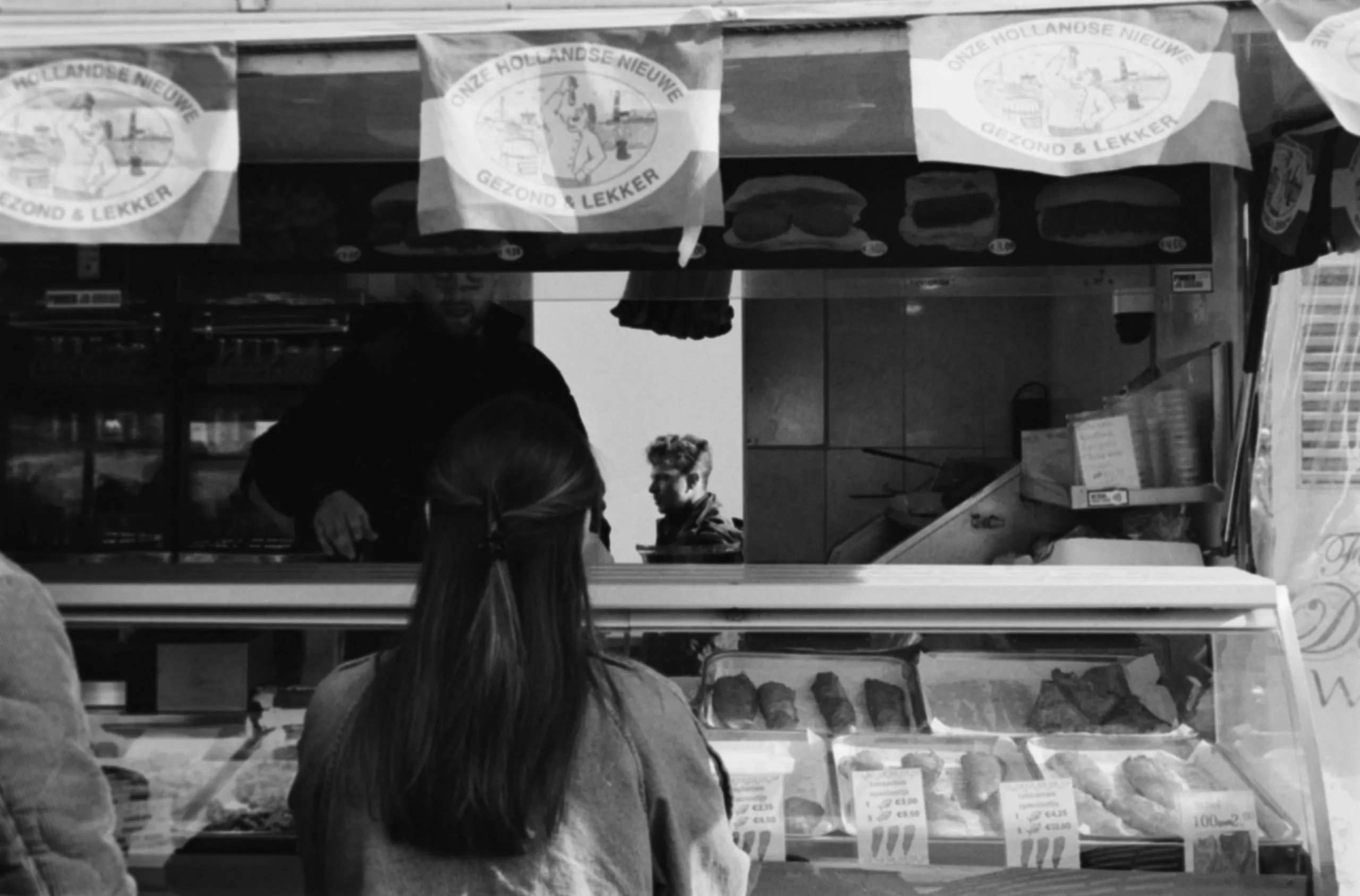 Street photography in the Netherlands Rotterdam on a market layer photo in B&W tmax 400.