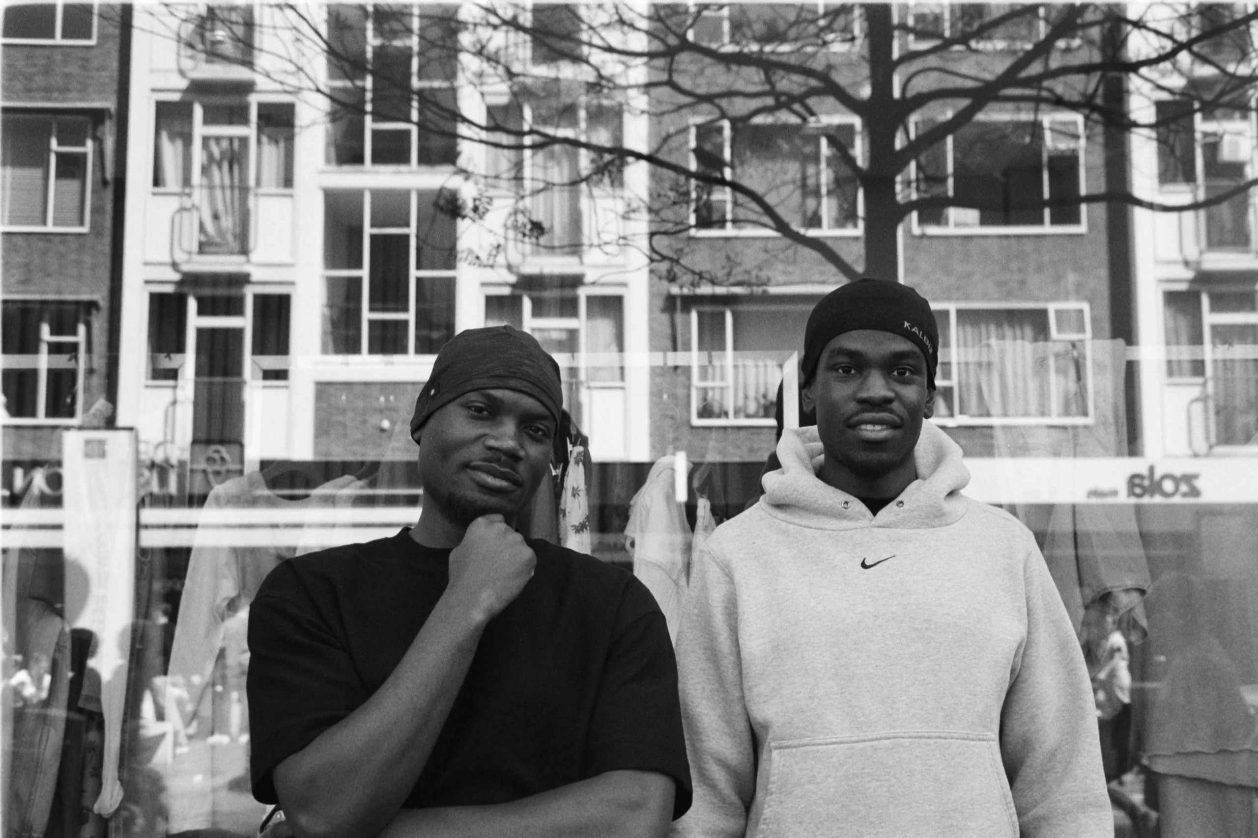 Street photography portrait in the Netherlands Rotterdam of two man posing on 35mm format film B&W ilford delta 400.