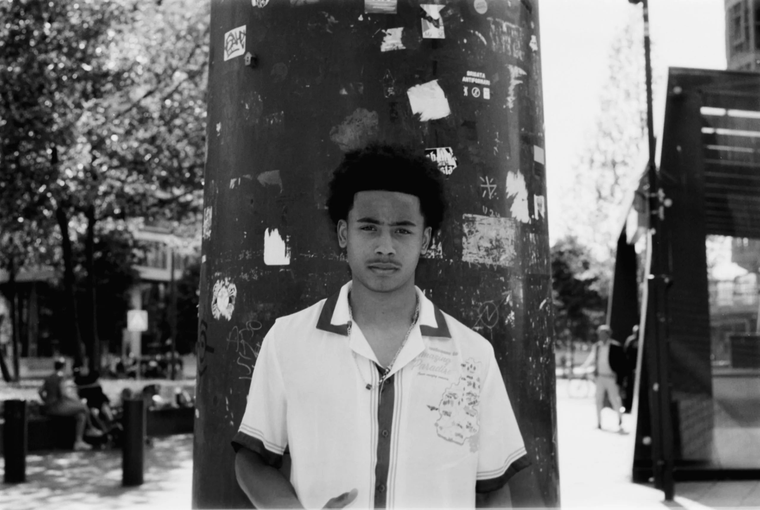 Street photography portrait in the Netherlands Rotterdam of a man posing on B&W film with flash 35mm ilford delta 400 film.