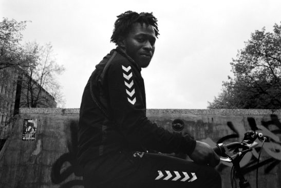 Man on bike shot on b&w film fuji ga645 without flash trix400.