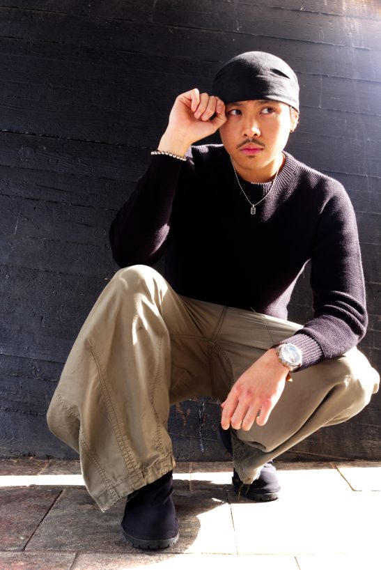 Man posing at Rotterdam Centraal taken with a fujifilm XE-3 on camera flash.