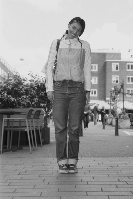Street portrait of a woman posing in Rotterdam.