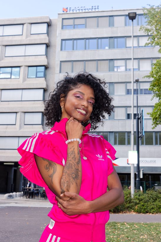 Woman wearing Adidas pink flashion clothing shot on XE-3 with on camera flash.