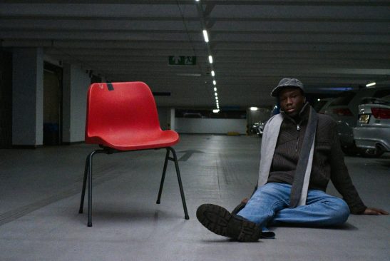 Street portret man garage rotterdam.